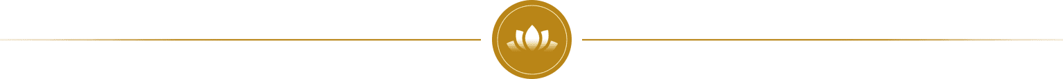 A gold colored circle with an image of a lotus flower.